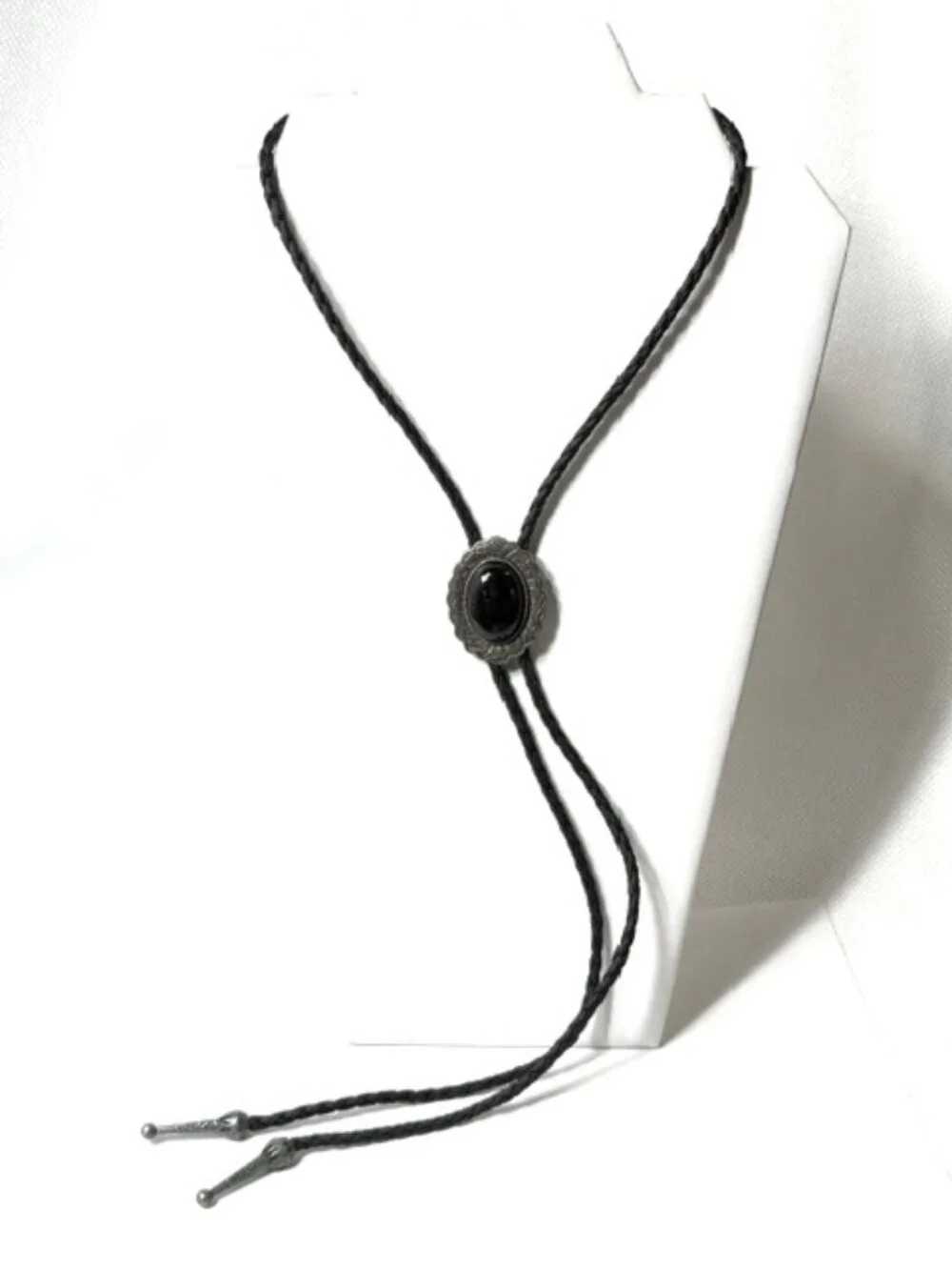 Pewter-tone, black stone, black cord western cowboy bolo tie.